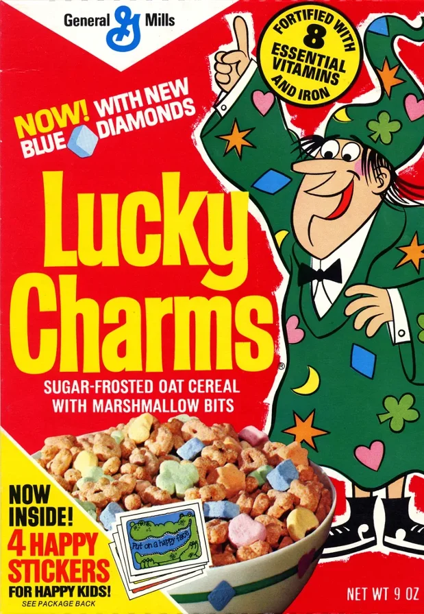 It took over ten years of market success and strong sales before Lucky Charms introduced new, limited edition charms. The blue diamond marshmallows were first debuted in 1975. Look closely at this box, and you'll notice that the oat cereal became sugar frosted, as we now know it today.