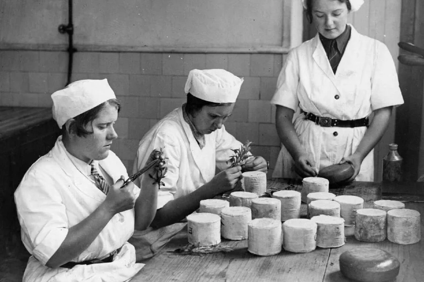 1935 - Women decorate cheeses with designs cut from herb leaves. Source: Three Lions