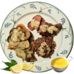 A plate full of seared elk steaks with side dishes of cooked lentils and mushrooms all covered with a lemon Dijon basil butter sauce.